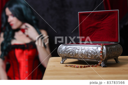Jewelry Box with Woman in Corset in background, Shallow DOF, Focus on Jewelry Box Jewelry Box with Woman in Corset in background, Shallow DOF, Focus on Jewelry Box 83783566