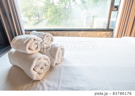 Set of soft towel on the bed in hotel bedroom. Conceptual of hotel amenities. Set of soft towel on the bed in hotel bedroom. Conceptual of hotel amenities. 83786176
