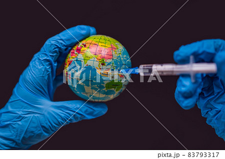 Syringe vaccinates the globe, on a map of the Indonesia. Indonesia Coronavirus, Corona virus attack concept. Indonesia fight against coronavirus. Concept of fight against coronavirus, danger and 83793317