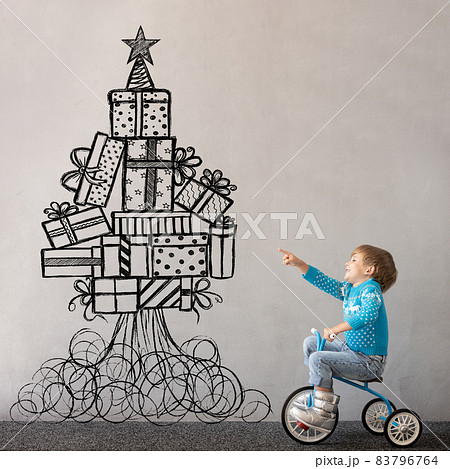 Happy child wearing Christmas sweater 83796764