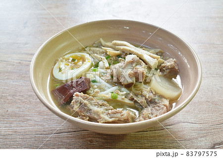 Vietnamese rice noodles or Pho with slice sausage and pork bone soup on bowl 83797575