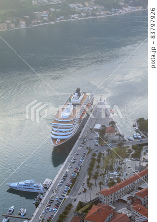 Top view of the cruise liner yachts and boats in Boka-Kotor Bay. The concept of tourism in Montenegro Top view of the cruise liner yachts and boats in Boka-Kotor Bay. The concept of tourism in Montenegro 83797926