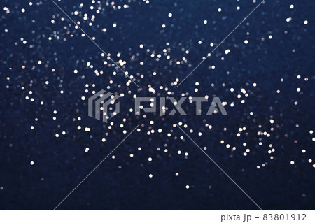 Festive Blue background of silver glitter lights. Winter blurred abstraction Festive Blue background of silver glitter lights. Winter blurred abstraction 83801912