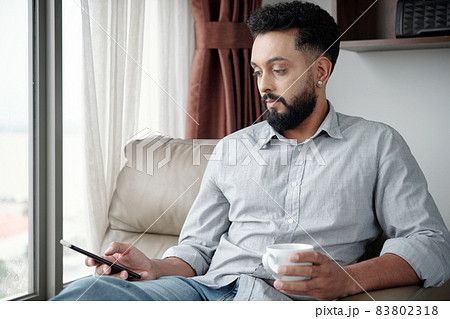 Man Answering Text Messages Man Answering Text Messages 83802318