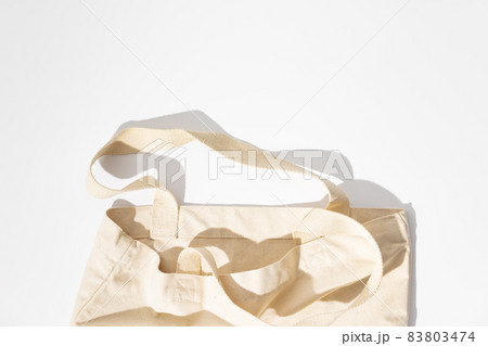 Eco-friendly cotton reusable bag on white background, flat lay, eco shopping 83803474
