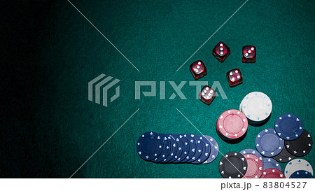 red dices casino chips green poker table. High quality beautiful photo concept red dices casino chips green poker table. High quality beautiful photo concept 83804527