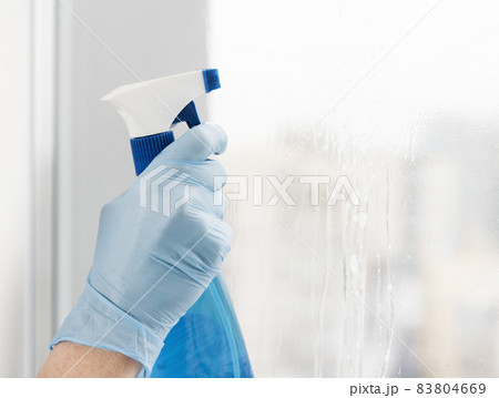 woman cleaning window. High quality beautiful photo concept 83804669