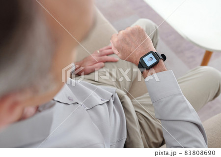 Man Using Application on Smart Watch 83808690
