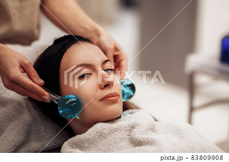 The woman is massaged face and body. 83809908