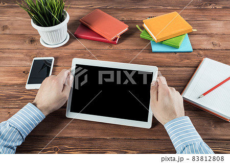 businessman with a tablet, works in the office businessman with a tablet, works in the office 83812808