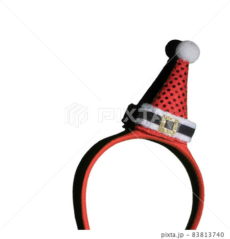 Closeup of Christmas headband with Santa hat isolated on white Closeup of Christmas headband with Santa hat isolated on white 83813740