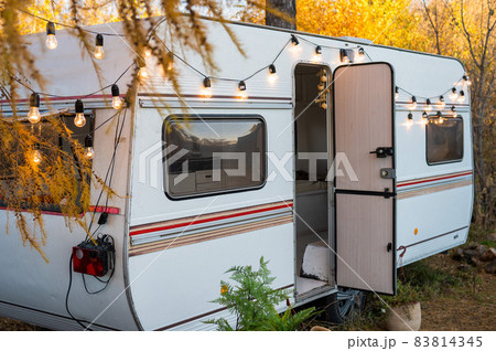 Camper or mobile home in the countryside. Cozy van in the autumn forest. 83814345