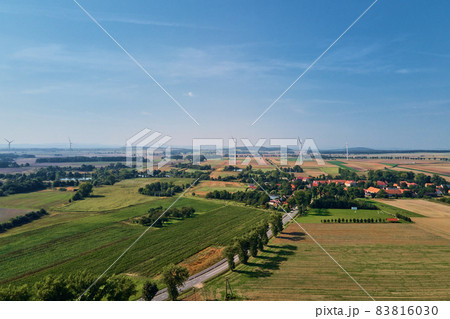 Small village near wind turbine generator, aerial view Small village near wind turbine generator, aerial view 83816030