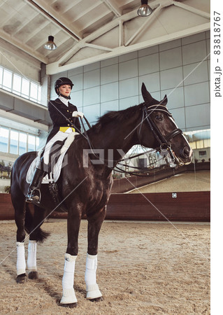 woman jockey with his horse woman jockey with his horse 83818767
