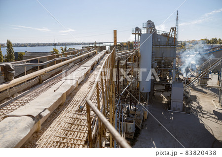 Factory with industrial facilities and buildings under blue sky Factory with industrial facilities and buildings under blue sky 83820438