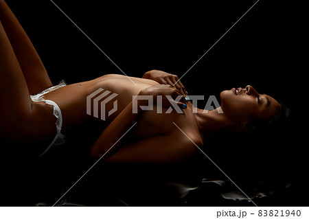 Young nude mirror Nude Woman Holding Dress To Self in Mirror Stock Image ...