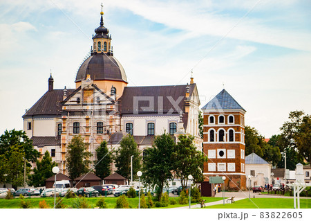 Old medieval building against the blue sky. Ancient architecture. House with red roof tiles. Old medieval building against the blue sky. Ancient architecture. House with red roof tiles. 83822605