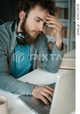 Businessman, Online Store Owner, Analyzes How to Increase Sales. Man Improving Business Sales Strategies in a Pandemic. Close-up Businessman, Online Store Owner, Analyzes How to Increase Sales. Man Improving Business Sales Strategies in a Pandemic. Close-up 83822658