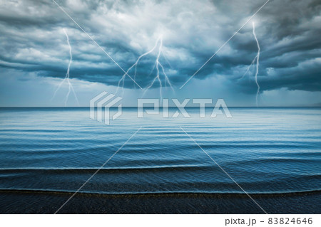 Dramatic sky and lightning clouds at sea. 83824646