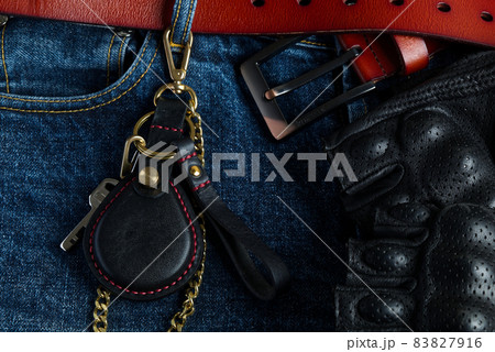 Famous Motorcycle Keyless Genuine Leather Case on Genuine Leather Background. 83827916