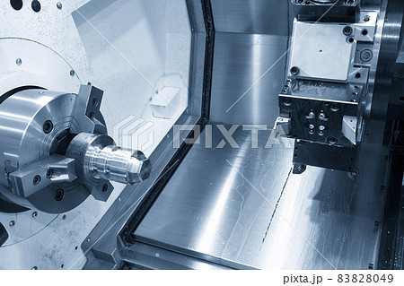 The  CNC lathe machine forming cutting at the metal  shape parts. 83828049