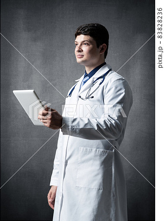 Doctor with a computer tablet Doctor with a computer tablet 83828236