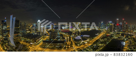 Aerial panoramic picture of Singapore skyline and gardens by the bay during preparation for Formula 1 race in the night in autumn Aerial panoramic picture of Singapore skyline and gardens by the bay during preparation for Formula 1 race in the night in autumn 83832160