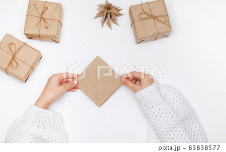 Christmas tree origami paper craft. The child performs the Step-by-step instruction. Step11 of 23 . DIY concept Christmas tree origami paper craft. The child performs the Step-by-step instruction. Step11 of 23 . DIY concept 83838577