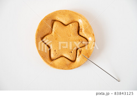 Brown sugar caramel candy cookies with a metal needle Brown sugar caramel candy cookies with a metal needle 83843125