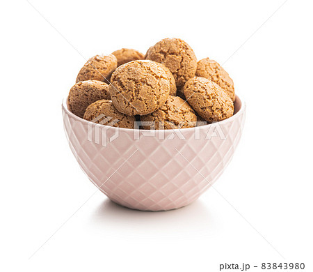 Amaretti biscuits in bowl. Sweet italian almond cookies. Amaretti biscuits in bowl. Sweet italian almond cookies. 83843980