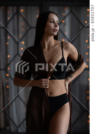 Alluring woman in underwear and silk robe 83852707