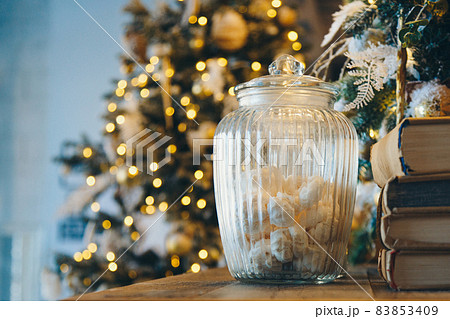 Meringue in a glass jar as part of the Christmas interior Meringue in a glass jar as part of the Christmas interior 83853409