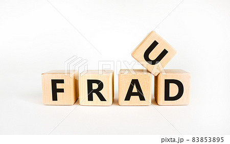Fraud symbol. The concept word 'fraud' on wooden cubes on a beautiful white table. White background. Business and fraud concept. Fraud symbol. The concept word 'fraud' on wooden cubes on a beautiful white table. White background. Business and fraud concept. 83853895