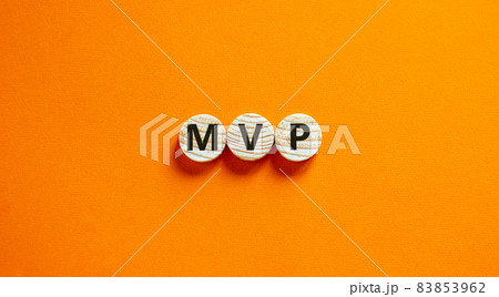 MVP, minimum viable product symbol. Wooden circles with the word MVP, minimum viable product. Beautiful orange background. Business and MVP, minimum viable product concept, copy space. 83853962