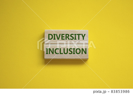 Diversity and inclusion symbol. Wooden blocks with words 'Diversity, inclusion' on beautiful yellow background. Business, diversity and inclusion concept. Copy space. 83853986