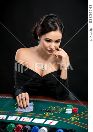 sexy woman with poker cards and chips sexy woman with poker cards and chips 83854543