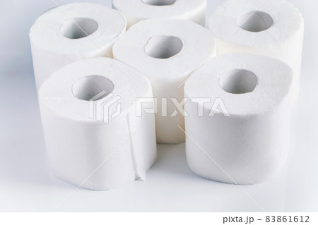 Rolls of toilet paper on a white background. Panic purchase of essential goods. Place for text. 83861612