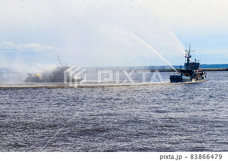 Extinguishing a burning ship during naval exercises Extinguishing a burning ship during naval exercises 83866479