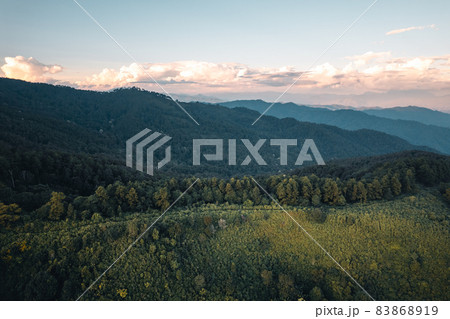 Scenic View Of Mountains Against Sky During Sunset 83868919