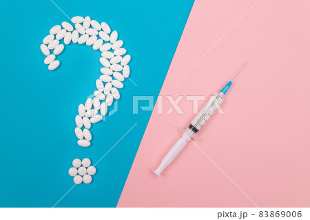 White Question Mark and Syringe. Pharmaceutical Industry and Vaccination White Question Mark and Syringe. Pharmaceutical Industry and Vaccination 83869006