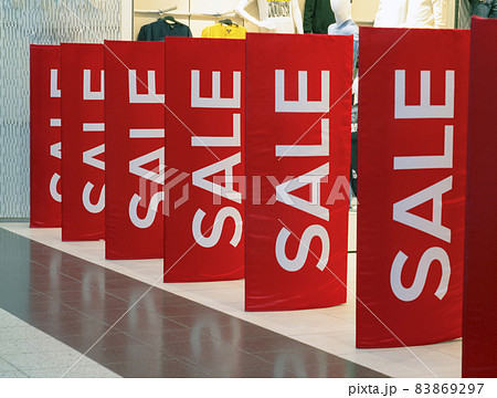 The red posters say SALE. Sale in the store. Horizontal photo 83869297