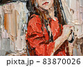 .Girl in the rain with an umbrella in her hands. 83870026