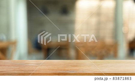 Empty wooden table or shelf on blurred background of restaurant. For present your products. 83871863