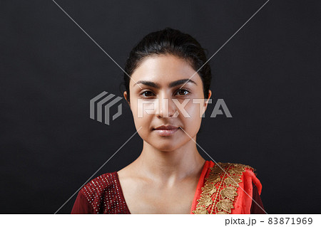 Portrait of young adult indian woman in sari Portrait of young adult indian woman in sari 83871969