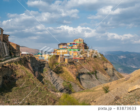 Old village on the top of mountain in Dagestan. Authentic Dagestani mountain village of Choh. Rural clay and stone houses. Russia. Old village on the top of mountain in Dagestan. Authentic Dagestani mountain village of Choh. Rural clay and stone houses. Russia. 83873633