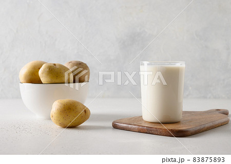 Vegan potato milk in glass, plant based milk replacer. Vegan potato milk in glass, plant based milk replacer. 83875893