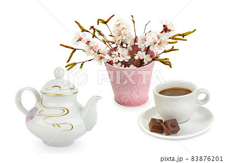 Cup with hot chocolate (or coffee) , vintage porcelain teapot for boiling water and bouquet of flowers isolated on white 83876201