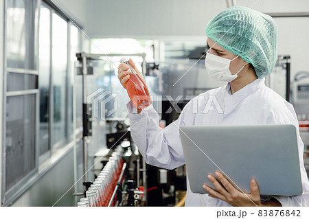 Quality control and food safety inspector test and check product contaminate standard in the food and drink factory production line with hygiene care. 83876842