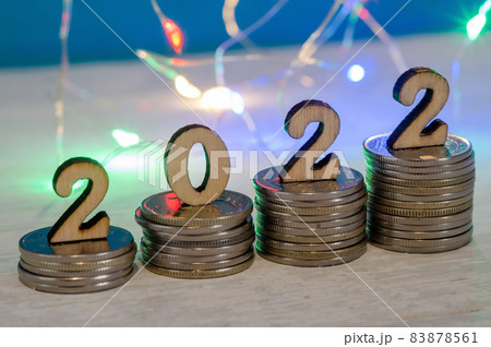 Banner 2022. Coins and Figures 2022. Money stacked in columns. 83878561