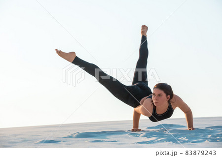 Young professional gymnast woman dance outdoor - sand beach 83879243